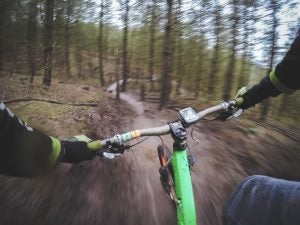 First person view of someone riding a bike on bike trail