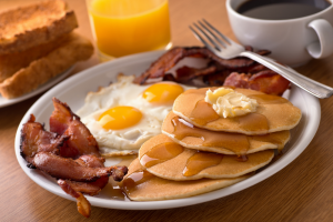 Breakfast platter with coffee and orange juice