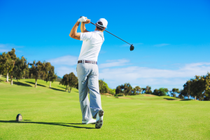 Man swinging a golf club