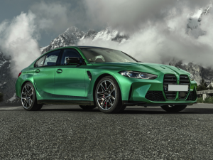 Front passenger view of green 2021 BMW M3