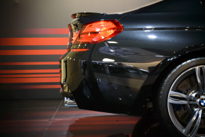 Rear passenger side view of a black BMW