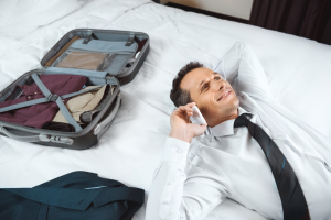 Man on a bed talking on the phone