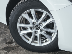 Tire on a white Mazda