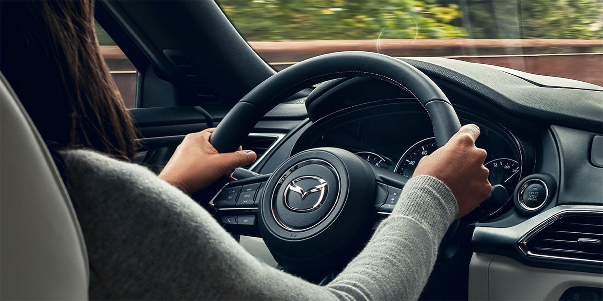 Dash board and steering wheel of a Mazda vehicle