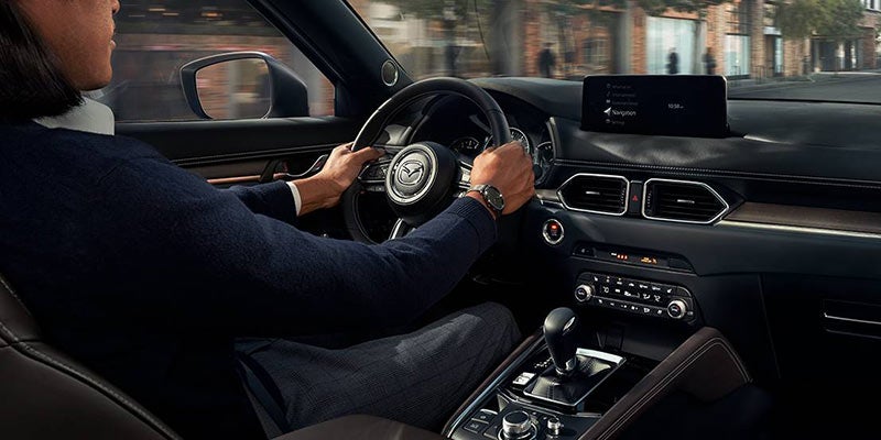 A driver experiencing Mazda SKYACTIV Technology