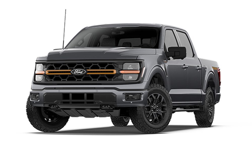 Gray Ford F-150 Tremor with orange grille accent shown from the front, at Valor Ford in Junction City