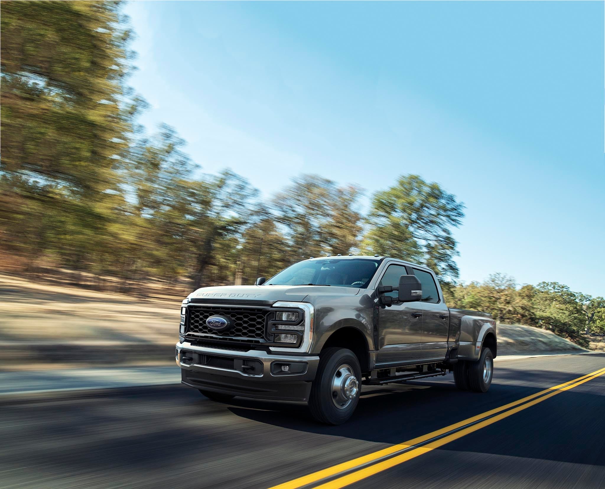 2026 Ford Super Duty F-350 XL with the STX appearance package being driven on a paved road