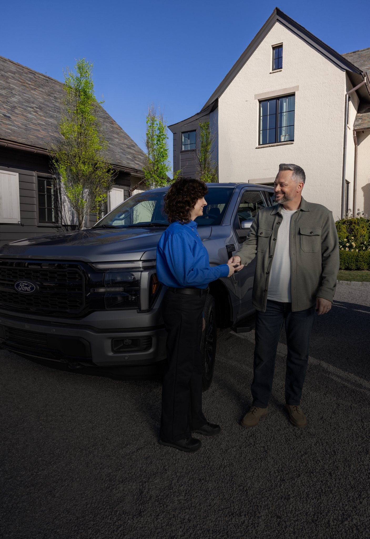 Ford Pickup and Delivery service representative greeting a customer