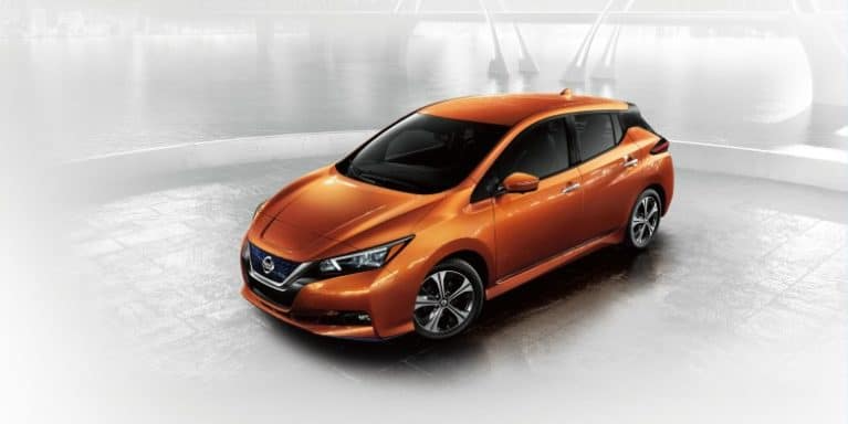 A 2022 Orange Nissan leaf.