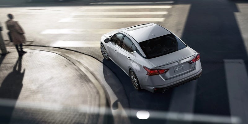 A 2024 Nissan Altima taking a sharp turn which can be avoided to save on gas mileage in Mayfield Heights, OH