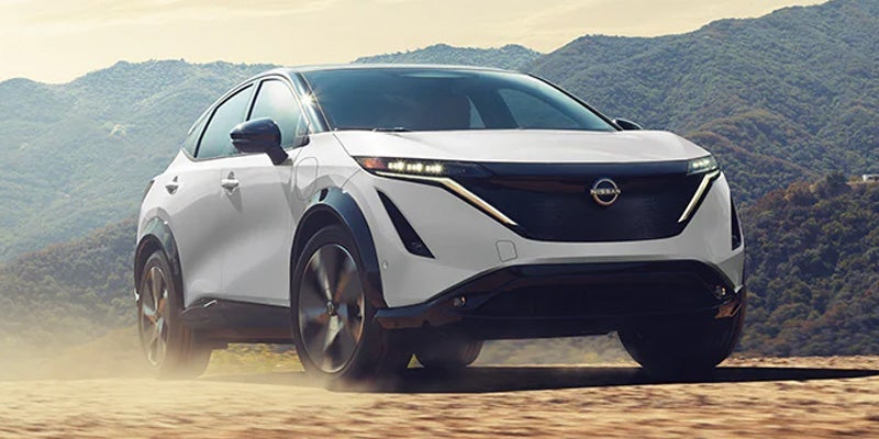 A 2024 Nissan Ariya driving on a dirt road near Mayfield Heights, OH 
