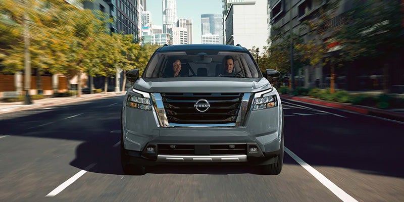 A 2025 Nissan Pathfinder head on driving down the road in Mayfield Heights, OH