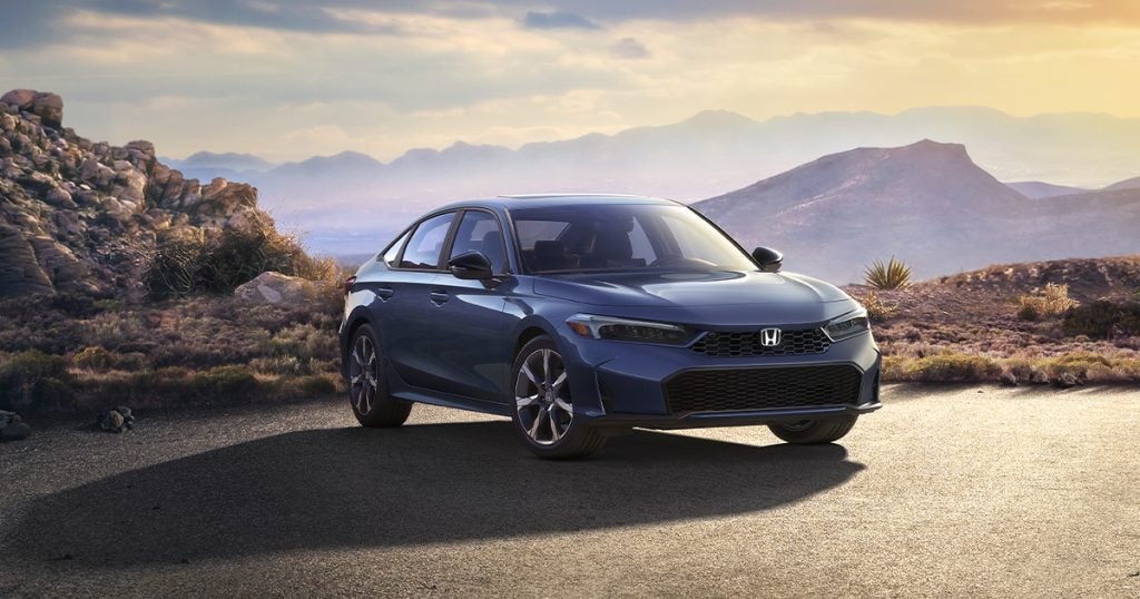 The 2025 Honda Civic parked off-road in the mountains.