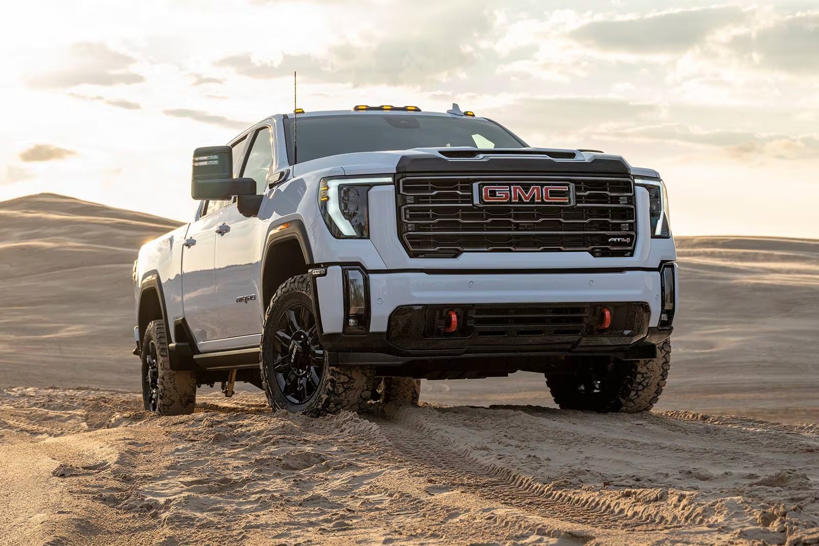 2024 GMC Sierra 3500 HD climbing a rocky desert hillside