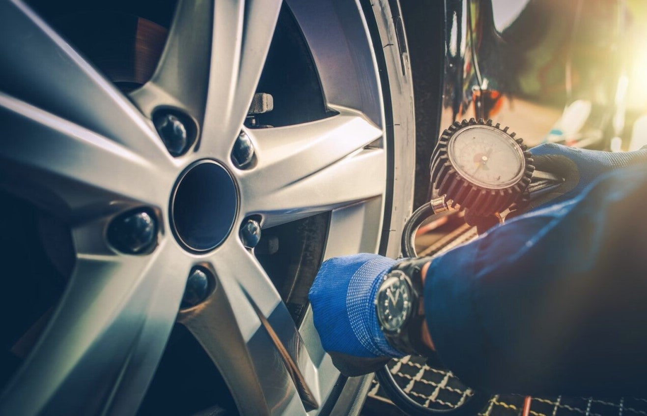 tire pressure being checked