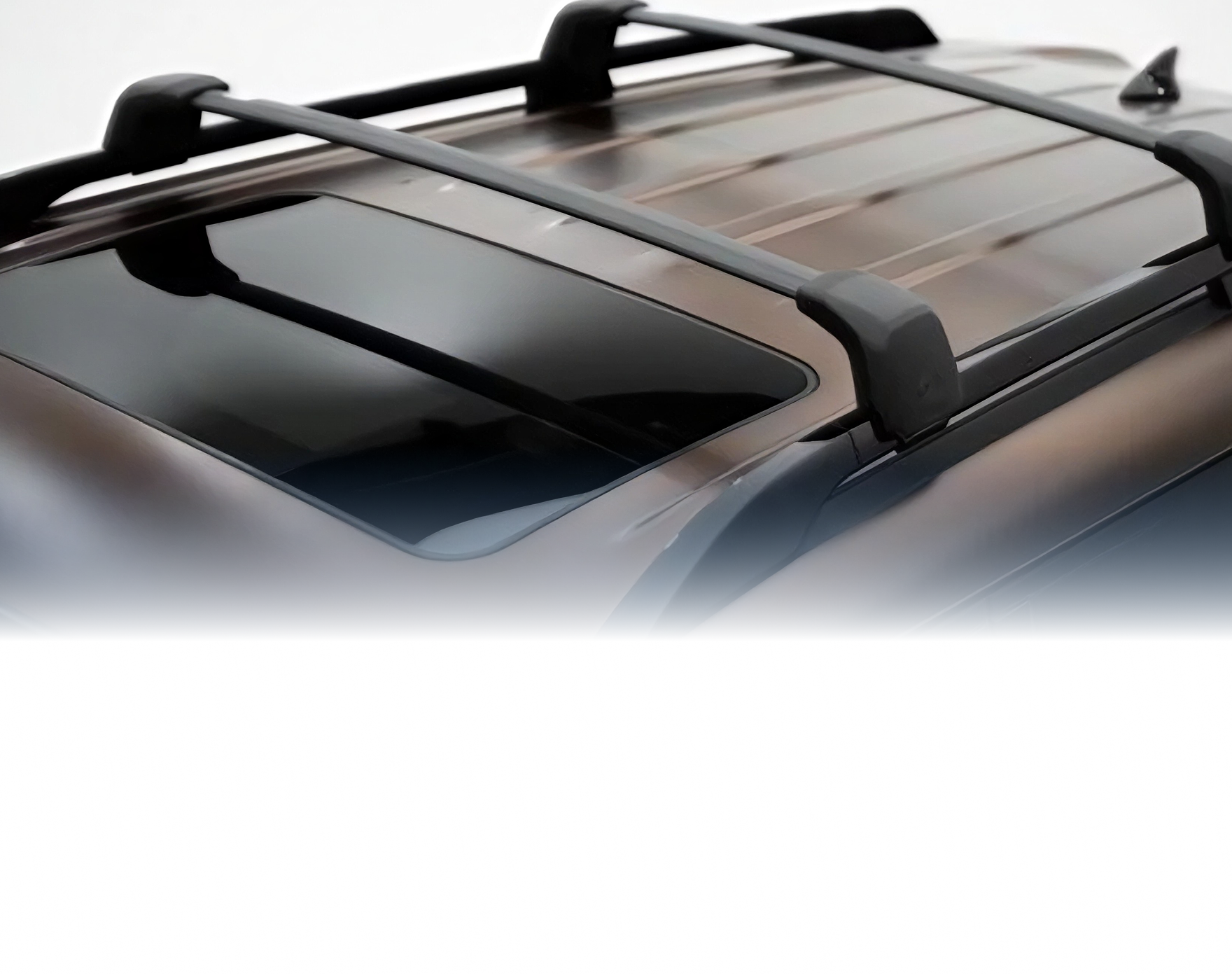 Black roof rack crossbars mounted on the roof of a Palisade