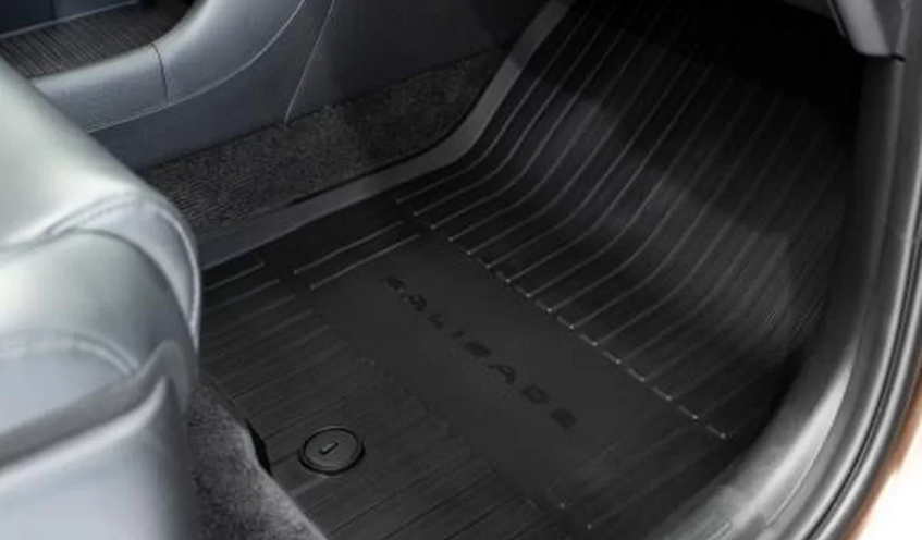 A black PALISADE-branded all-weather floor liner in the cabin