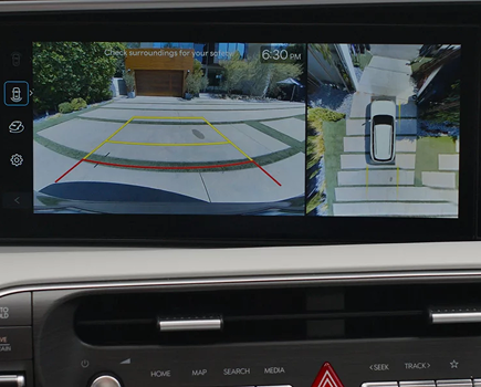 The Palisade touchscreen showing rear camera parking guidelines and a top-down view