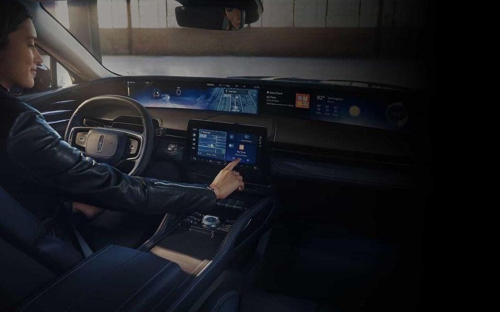 Woman Driver inside a Lincoln Nautilus with Dashboard Technology
