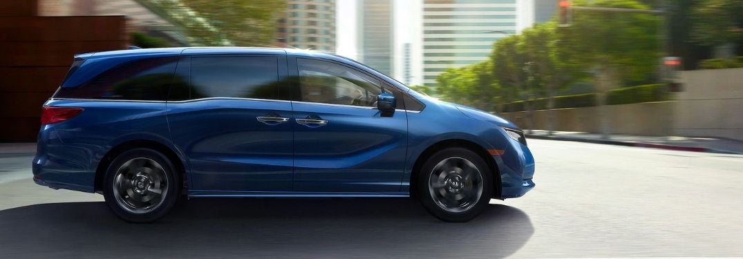 Blue 2021 Honda Odyssey Side Exterior on a City Street
