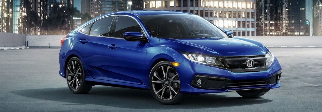Blue 2020 Honda Civic Sedan on a Street at Night