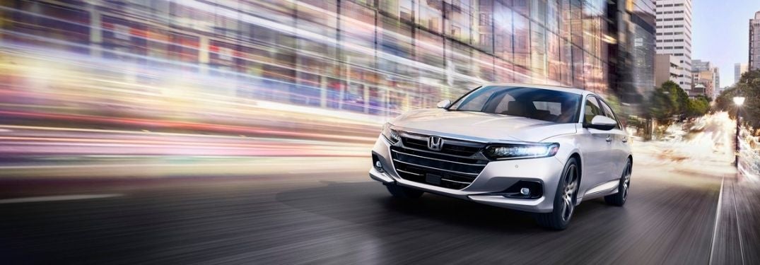 White 2021 Honda Accord on a City Street at Night