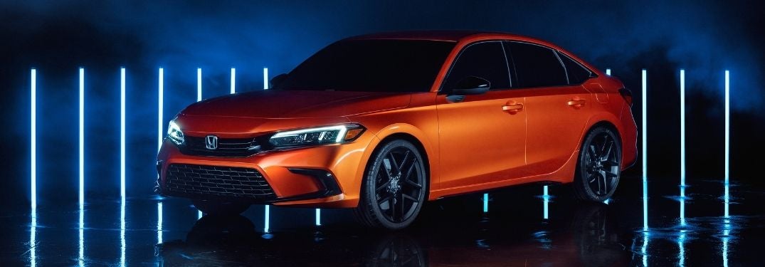 Orange 2022 Honda Civic Prototype on a Dark Blue Background