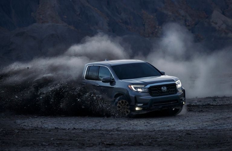 Gray 2021 Honda Ridgeline Kicking Up Dirt