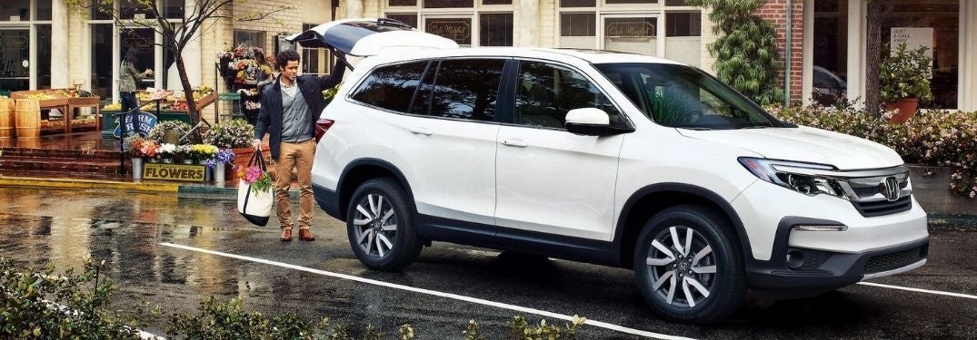White 2021 Honda Pilot on City Street at Farmers Market