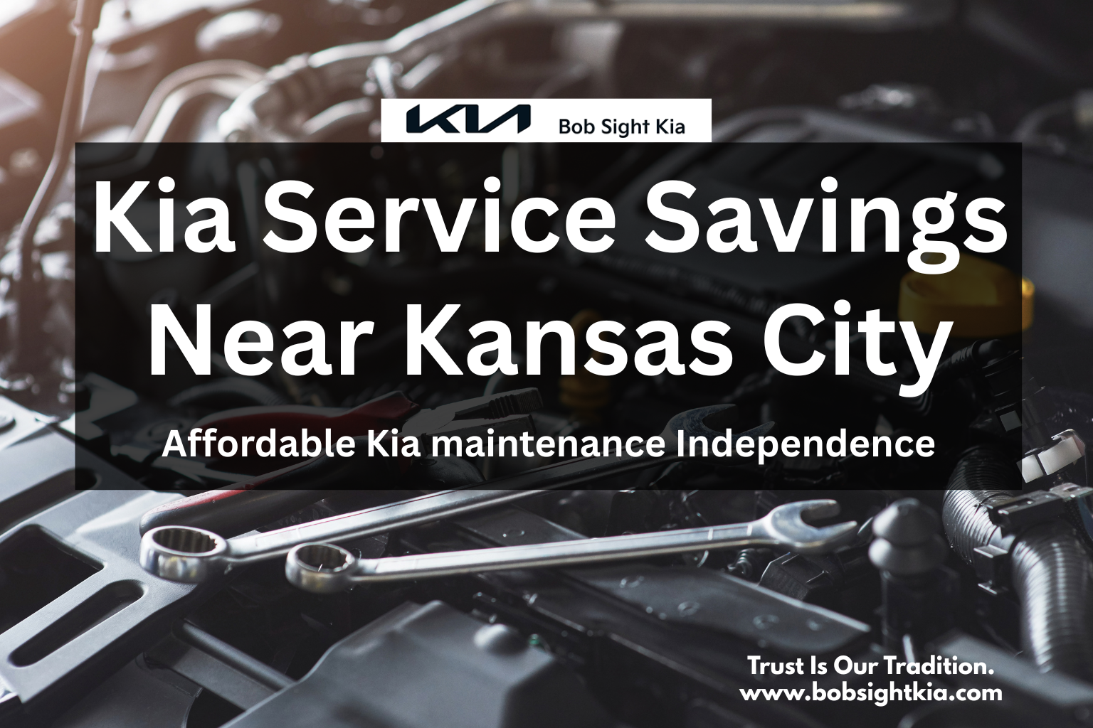 Technician servicing Kia vehicle at Bob Sight Kia in Independence MO with service specials