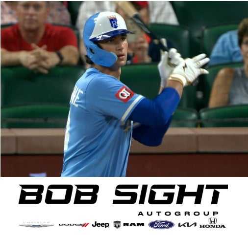 Kansas City Royals batter mid-swing with the Bob Sight Auto Group logo overlay, highlighting local dealership support for hometown teams.