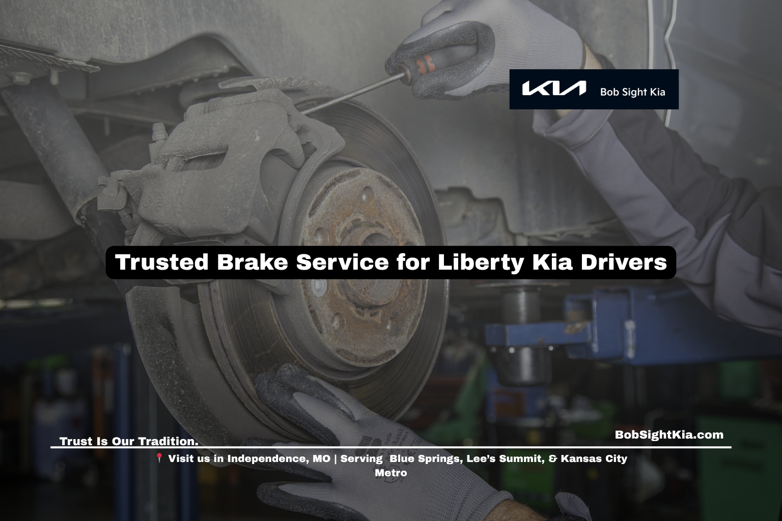Certified Kia technician performing brake inspection near Liberty MO at Bob Sight Kia Independence