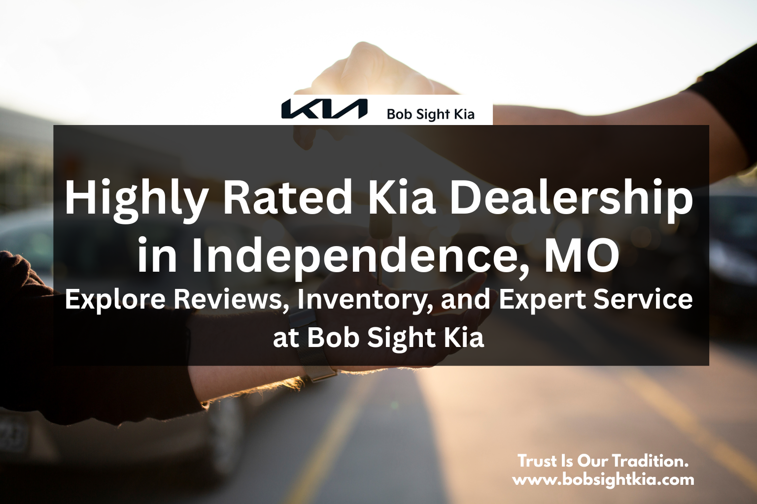 Customer receiving keys to their new Kia vehicle at Bob Sight Kia in Independence, MO