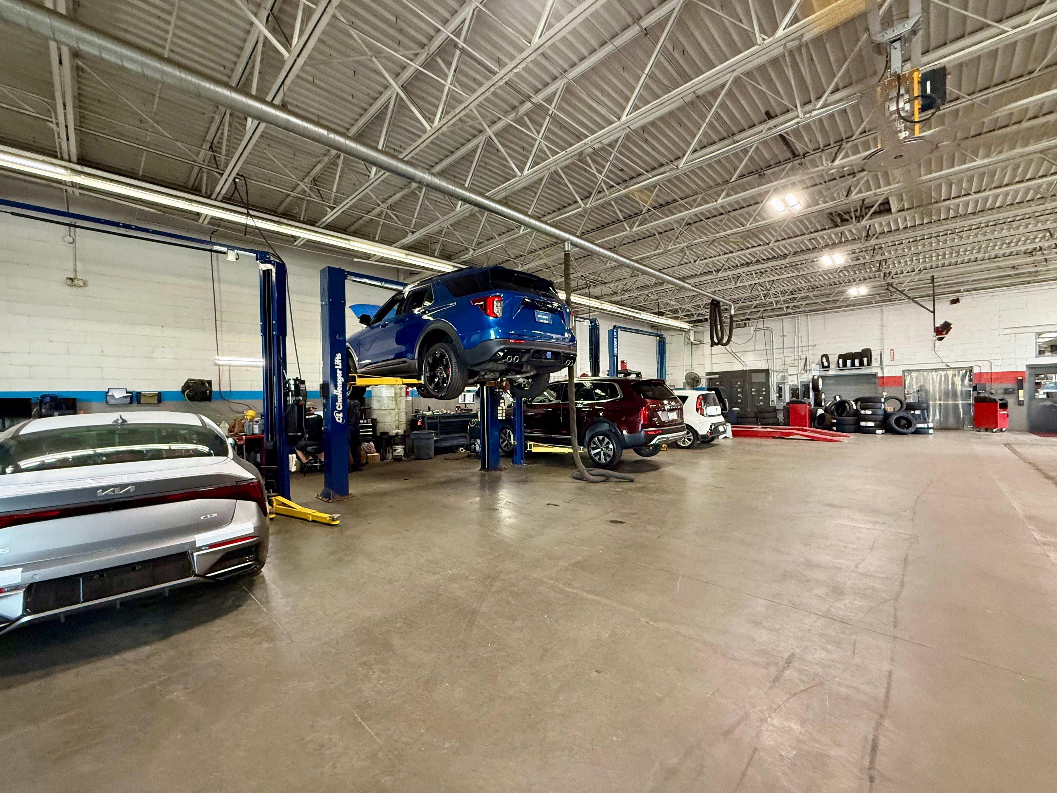 Kia service bays and lifts at Bob Sight Kia near Lee's Summit MO