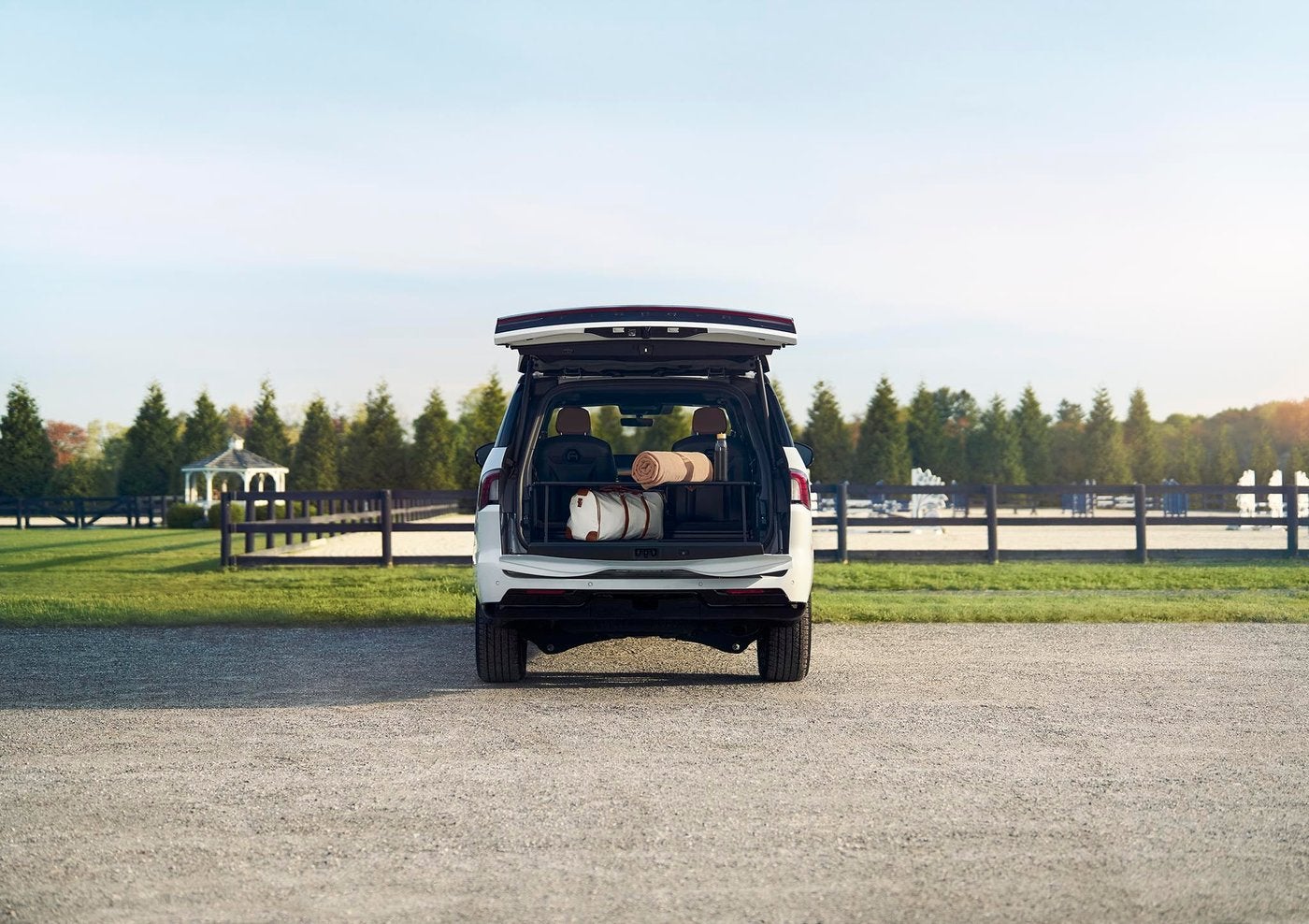 White 2027 Lincoln Navigator from behind with the Split Gate open and luggage loaded White 2027 Lincoln Navigator from behind with the Split Gate open and luggage loaded