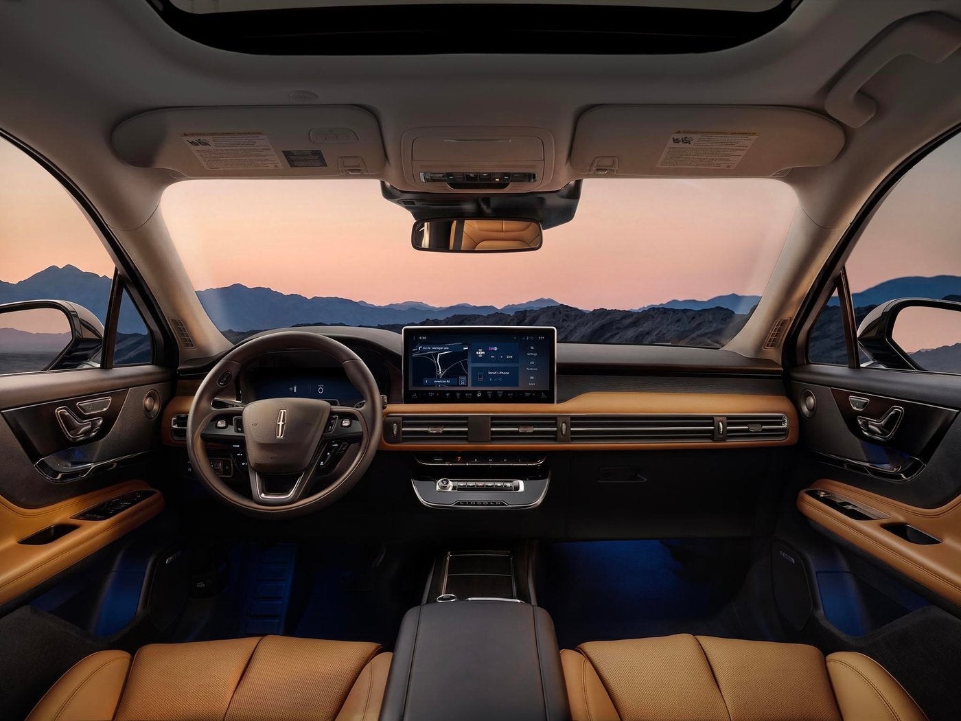 Lincoln Corsair cockpit with tan leather seats, center touchscreen and panoramic roof