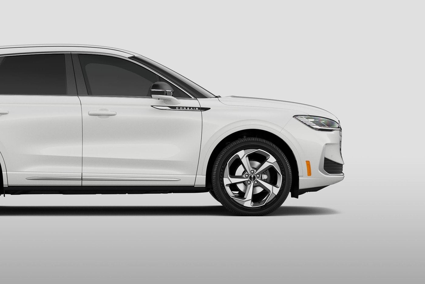 White Lincoln Corsair two row SUV in side profile White Lincoln Corsair two row SUV in side profile