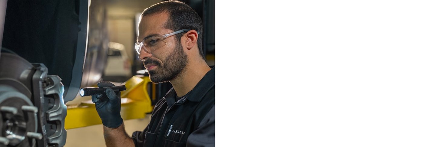 Lincoln Service, certified technician servicing brakes, Dallas TX
