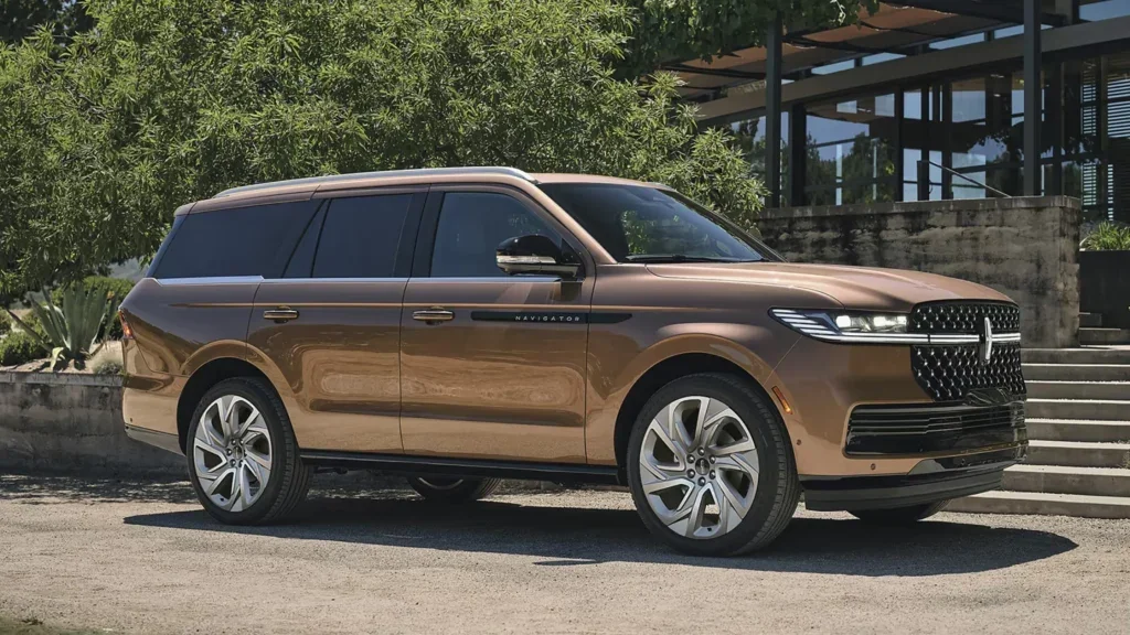 The 2025 Lincoln Black Label Navigator® in a unique bronze finish, parked outside a modern luxury building.
