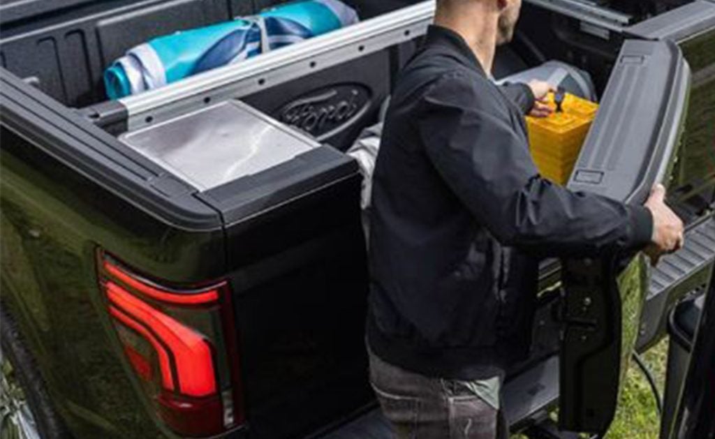 Man opening the door in the Pro Access Tailgate.