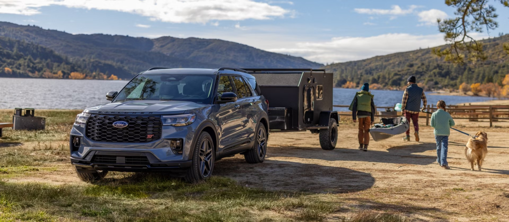 2026 Ford Explorer pulling a popup camper.