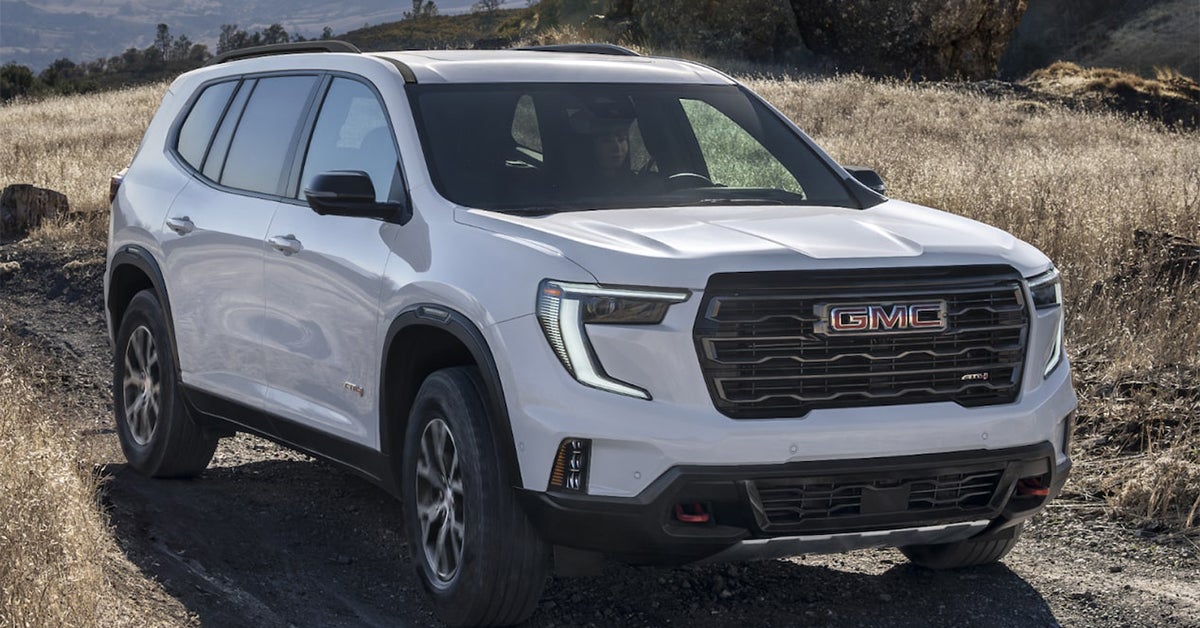 2025 GMC Acadia traversing through watery roads