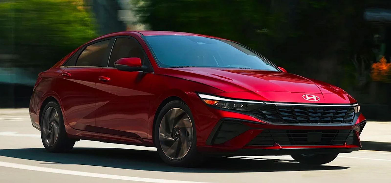 The 2024 Hyundai Elantra driving on a road