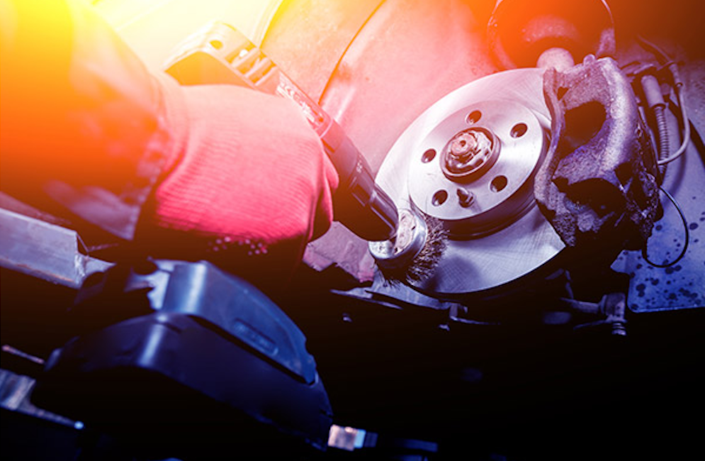 A close-up shot of a vehicle's wheel being repaired