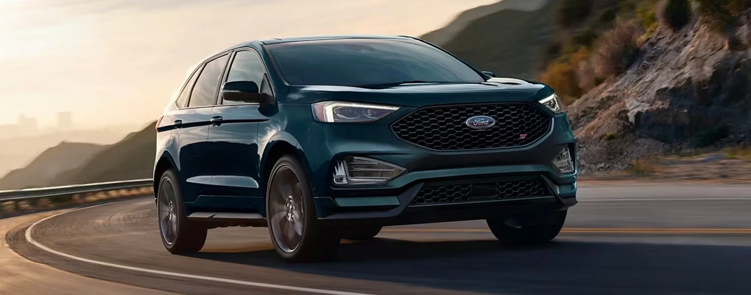 The 2024 Ford Edge driving in a wide landscape shot