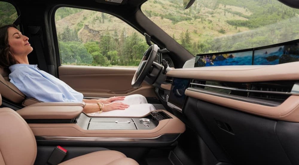 A person reclining in a 2026 Lincoln Navigator.
