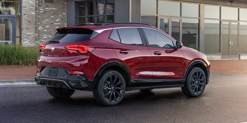 Red 2025 Buick Encore GX in front of Store