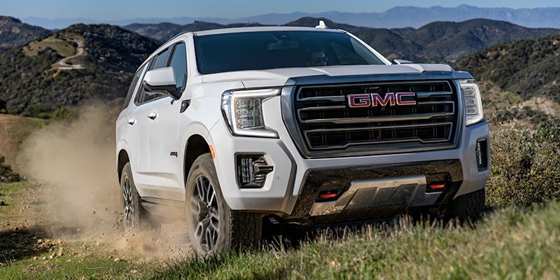 White GMC Yukon Offroad in Mountains