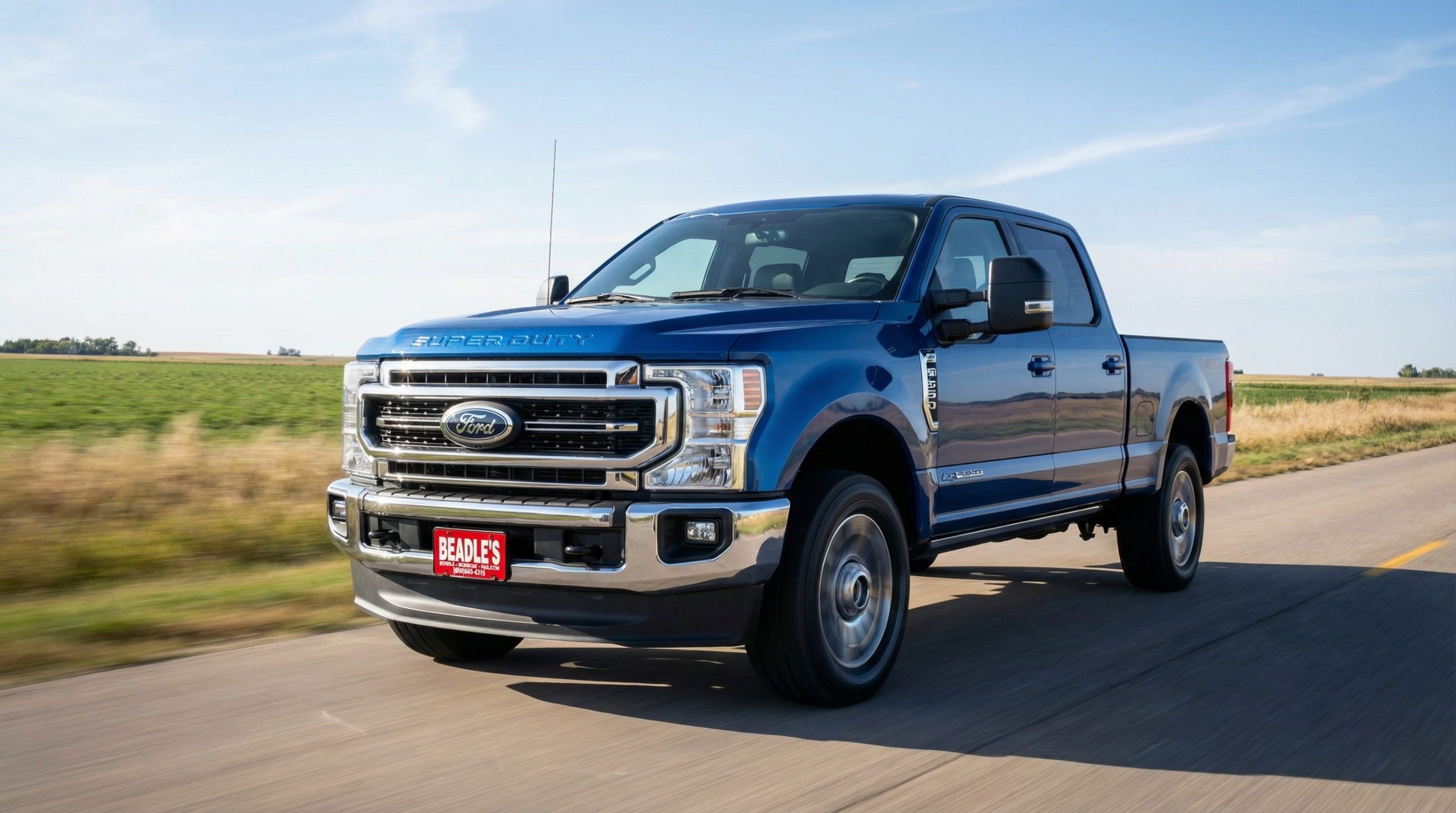 2026 Ford F-350 Super Duty driving on a rural South Dakota road