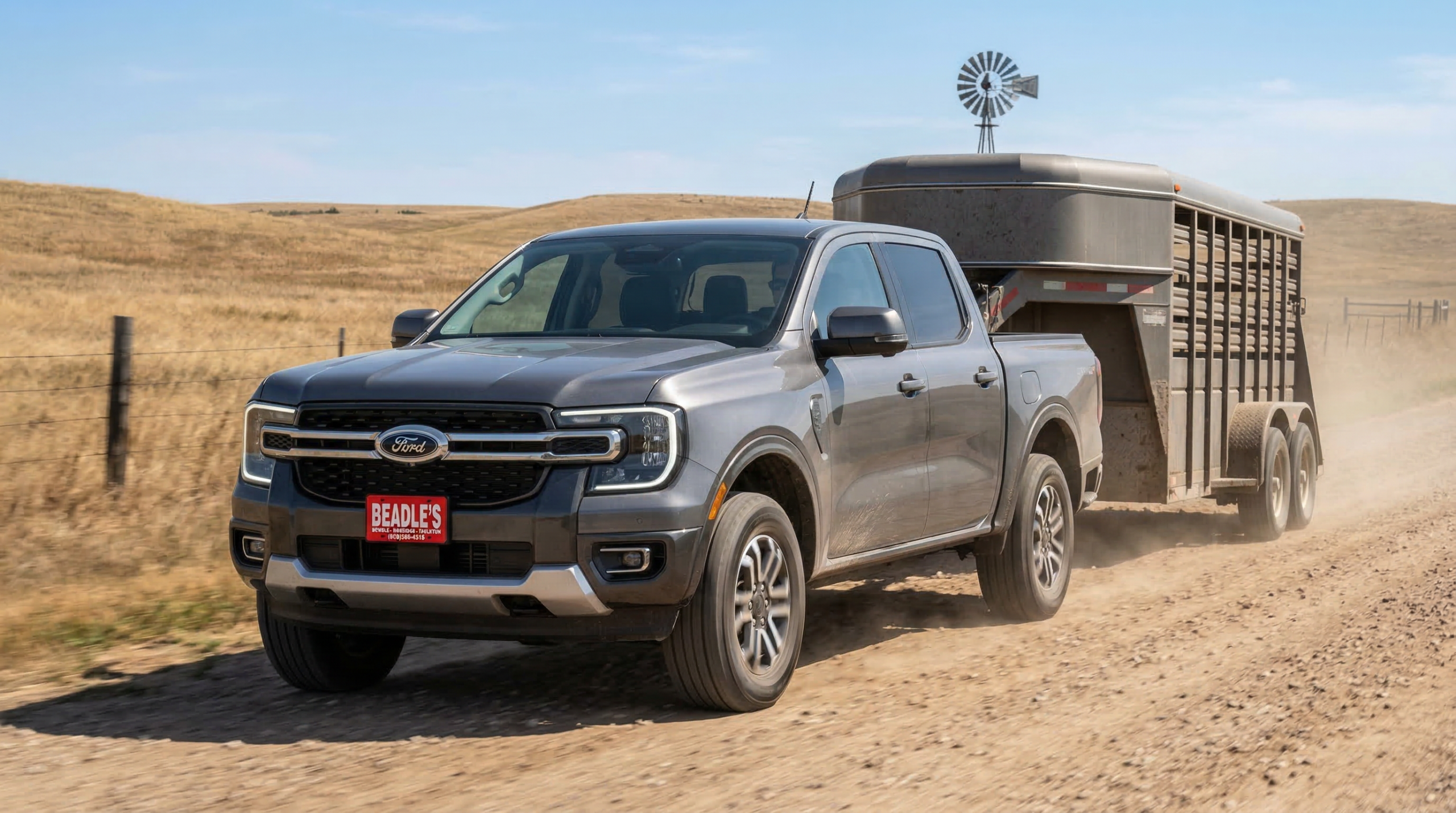 2026 Ford Ranger Lariat towing a livestock trailer on a South Dakota ranch road